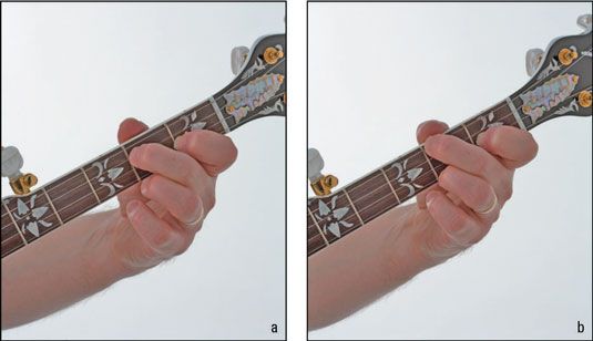 Ici's how your hand looks fretting the D7 (a) and C (b) chords. Note the position of the thu